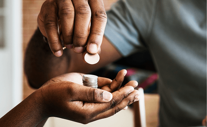 Hands giving coins